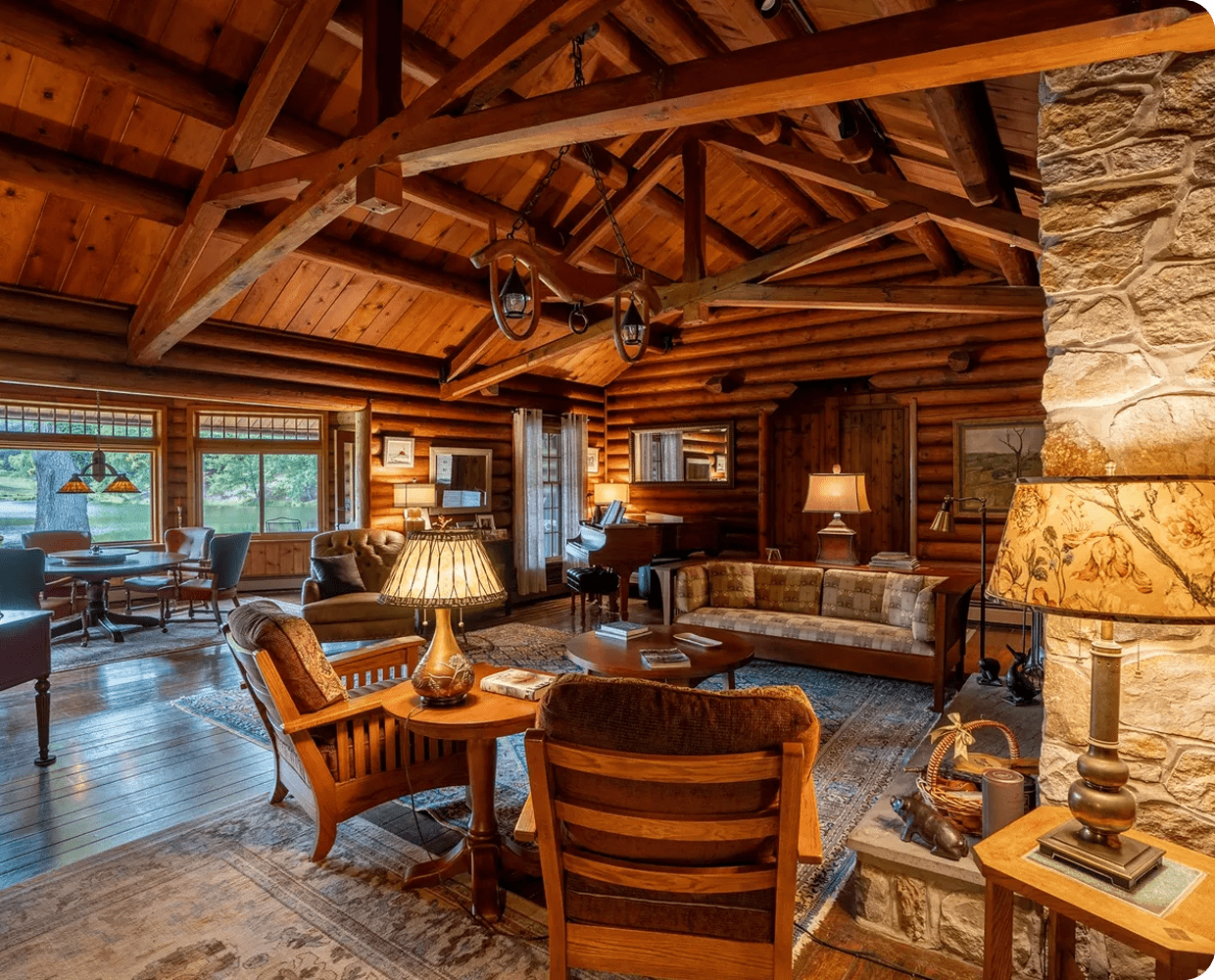 Rustic log cabin living room with fireplace.